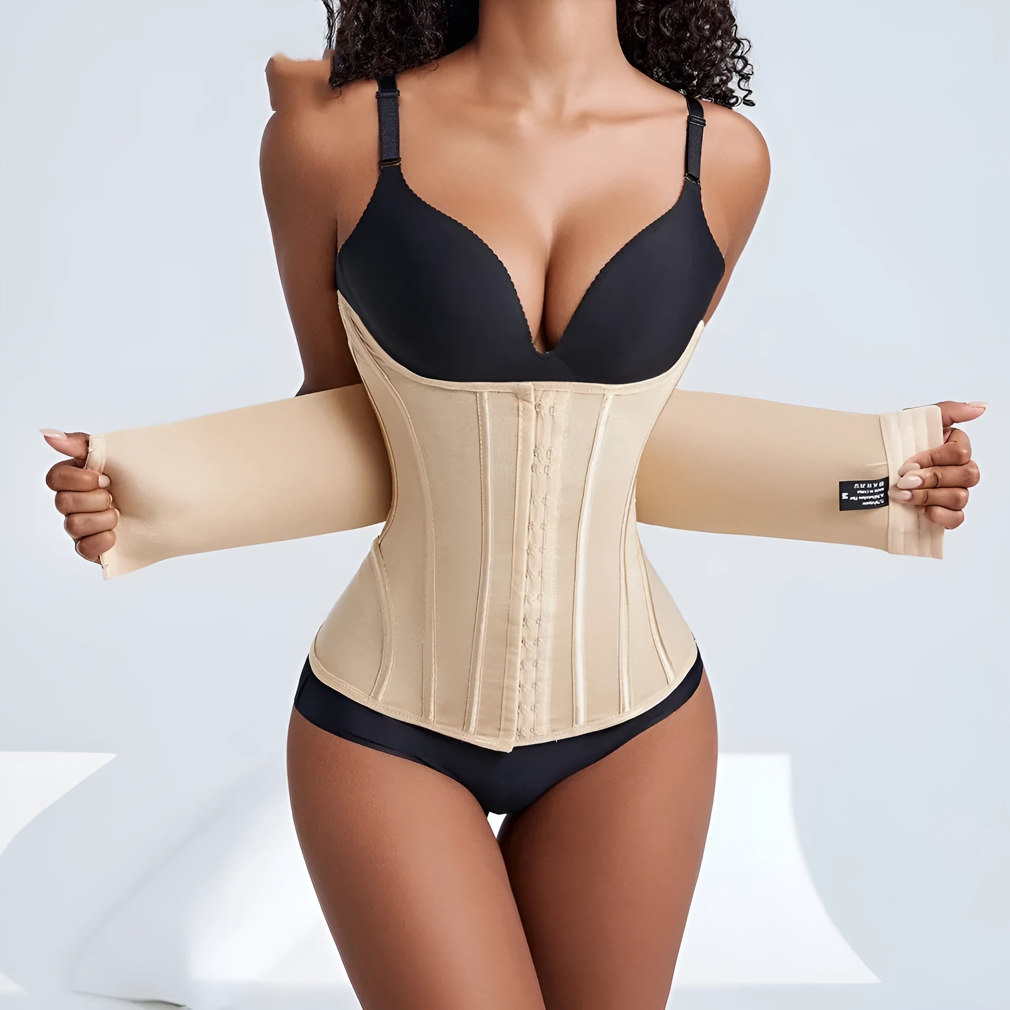Nylon belly band waist trainer for tummy slimming in black and apricot colours.