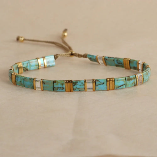 Geometric pull bead bracelet with round glass beads in multiple colour options.