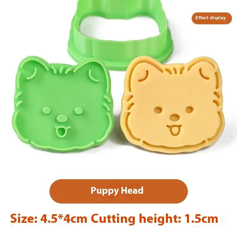Plastic biscuit mould showing three-dimensional puppy head design with birthday hat for baking