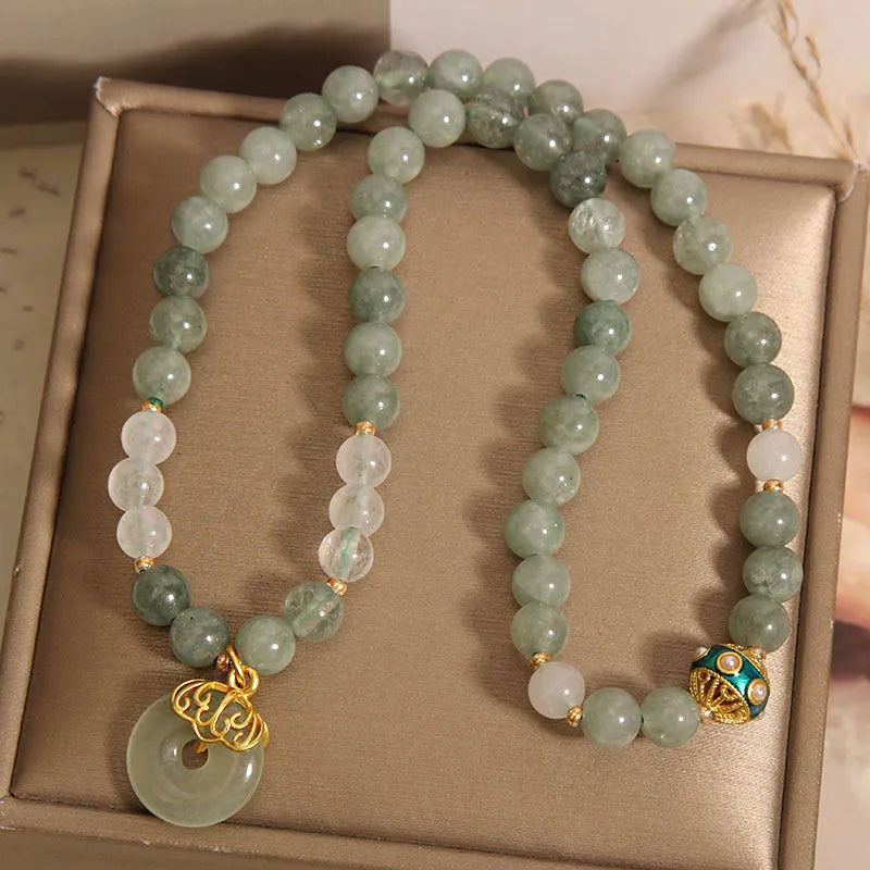 Women's double-layer crystal bracelet with peace buckle in oil emerald colour and rhinestone detailing