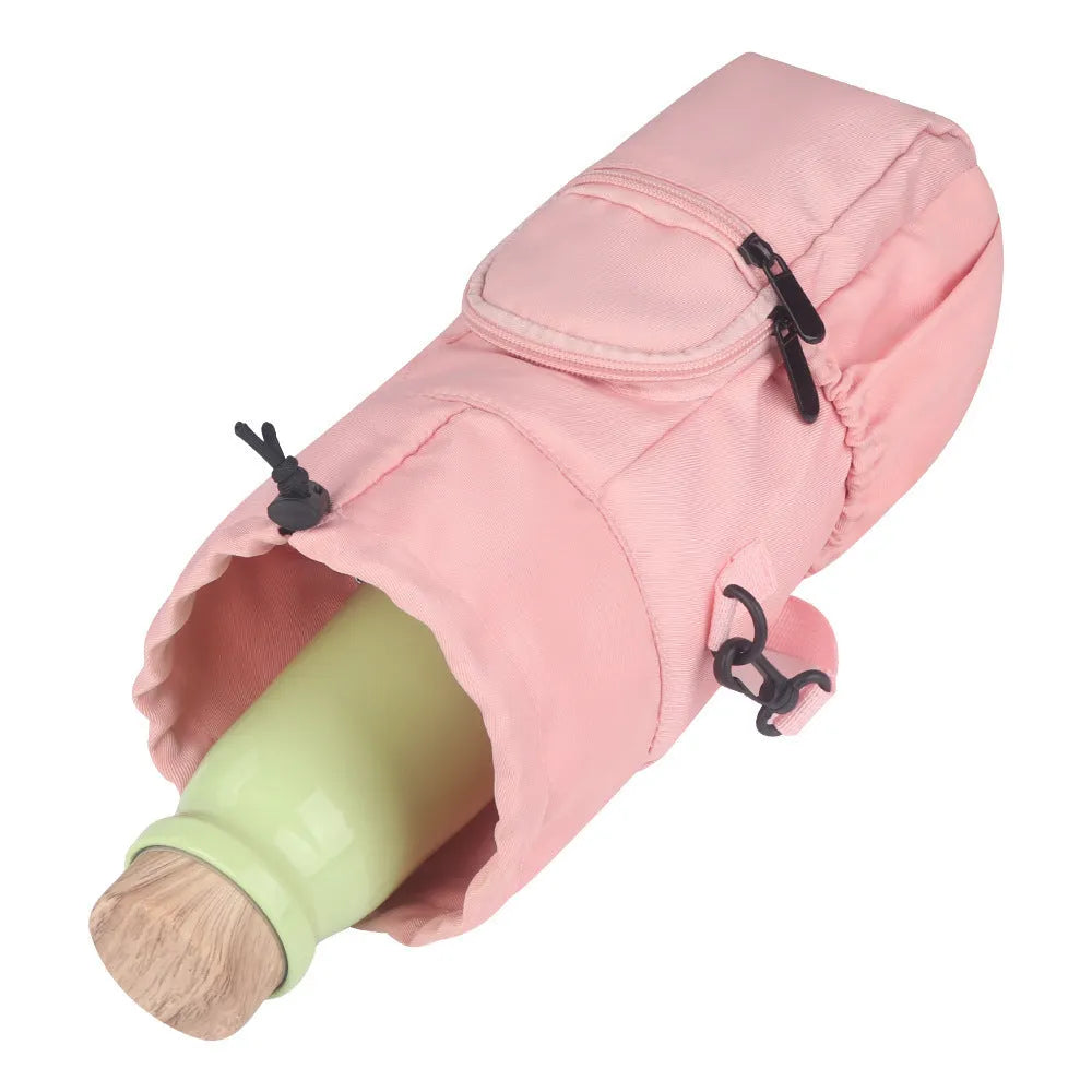 Canvas crossbody water bottle pouch in black green and pink holding a cup