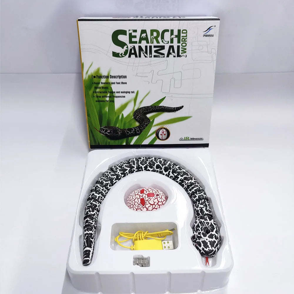 Automatic electronic snake cat toy with segmented plastic body on a floor.