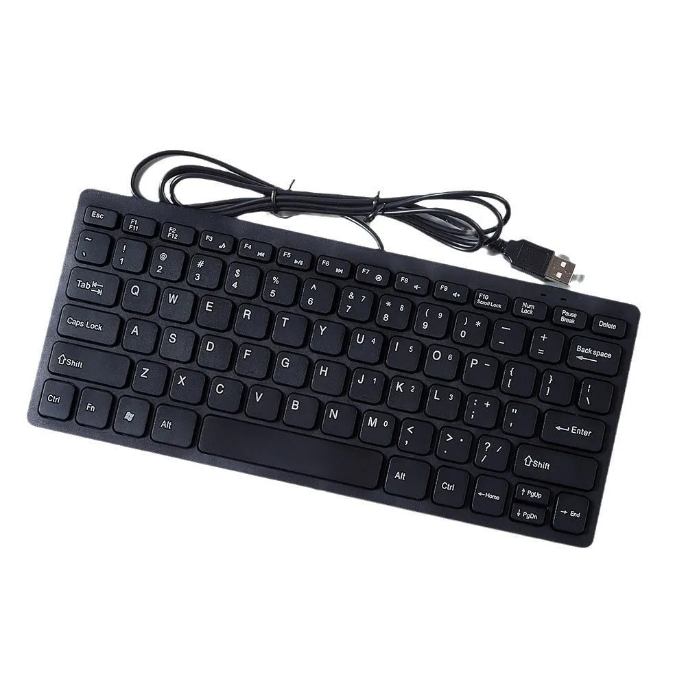 Compact black wired USB keyboard with noiseless keys on a desk.