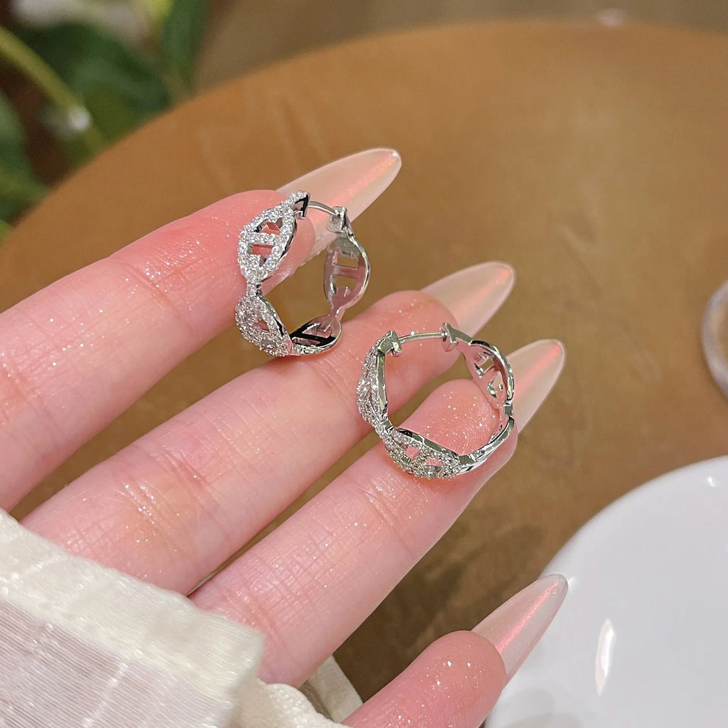 Ladies diamond-effect drop earrings in silver, gold, and rose gold electroplated finishes.