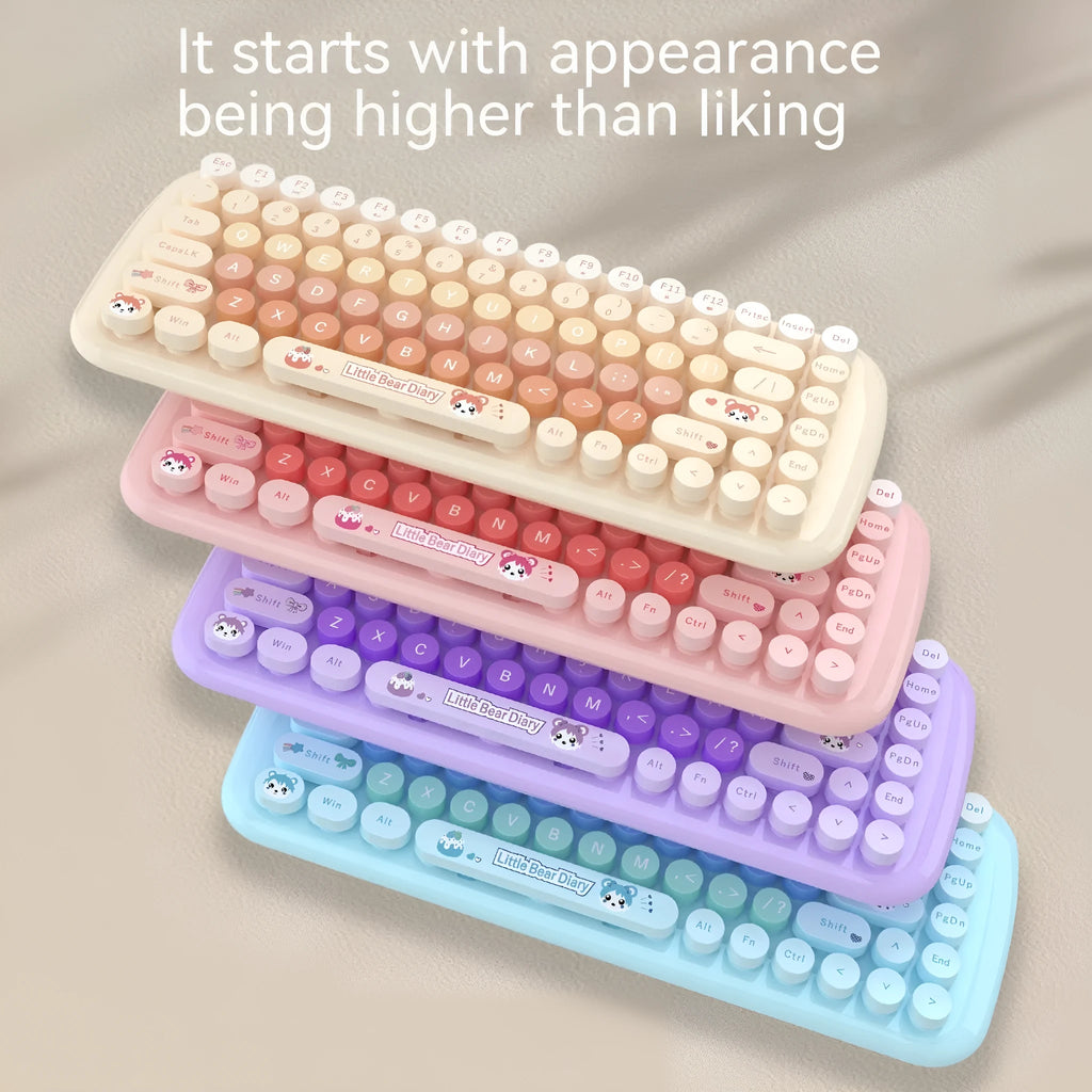 Pink wireless keyboard and mouse set with compact design on a desk