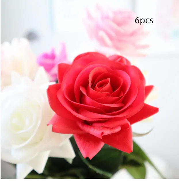 Artificial silk rose bouquet with red fabric flower head and green plastic stem