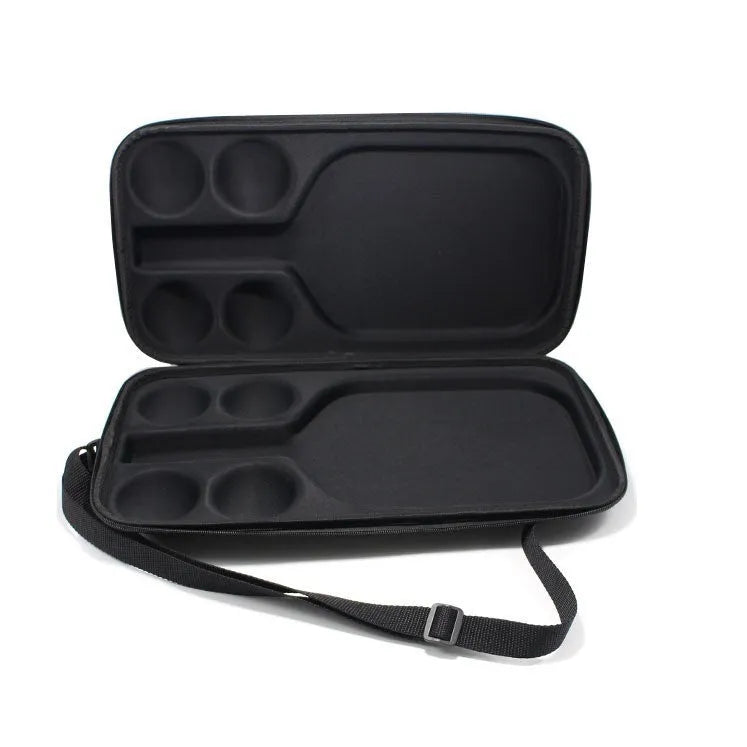 Black waterproof pickleball storage bag with two shoulder straps, showing size relative to a racket and balls.