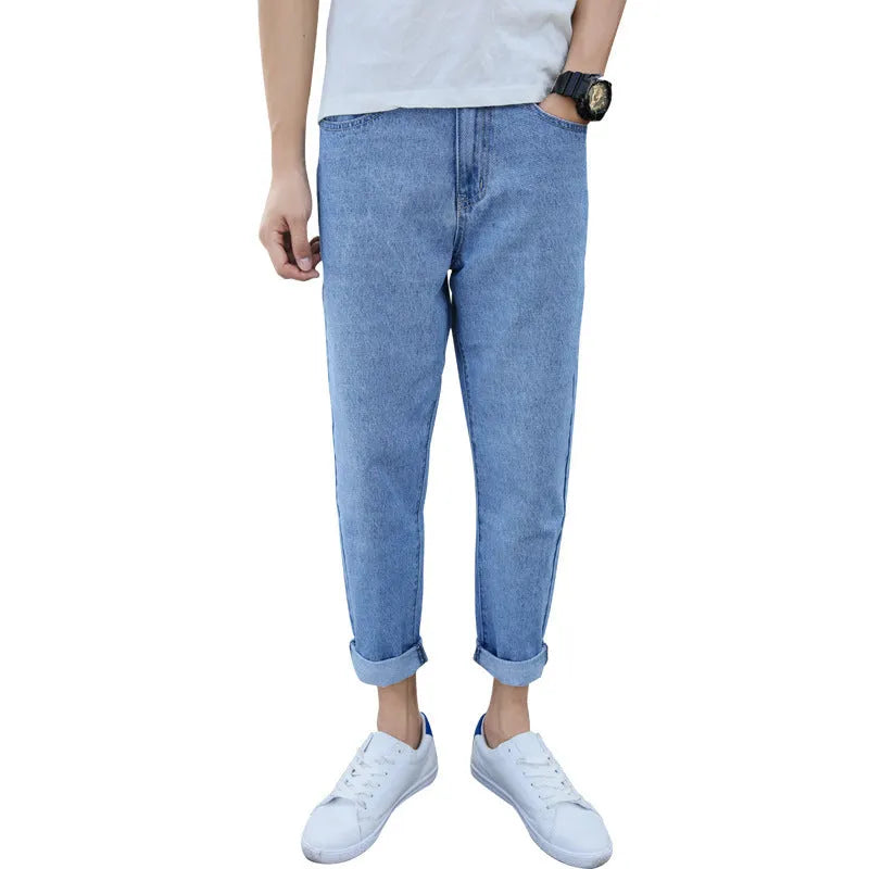 Men's loose straight leg blue cotton jeans with a college style on a casual background.