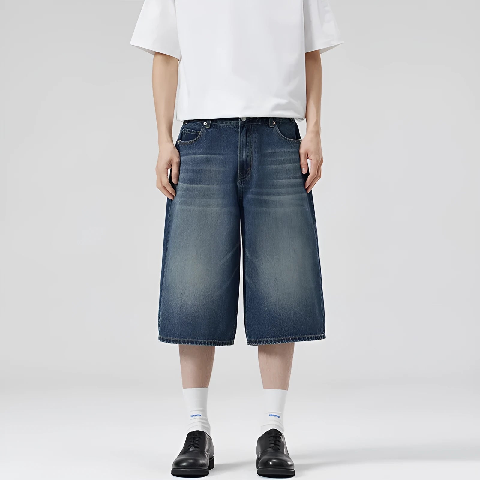 Men's light blue cotton denim shorts with a straight leg and cropped length on a hanger