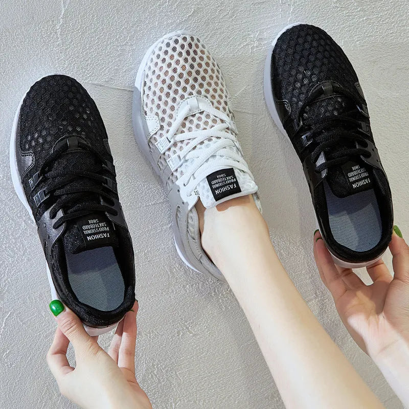 Low-top casual sneaker with mesh hollow-out upper and flat EVA sole in white.
