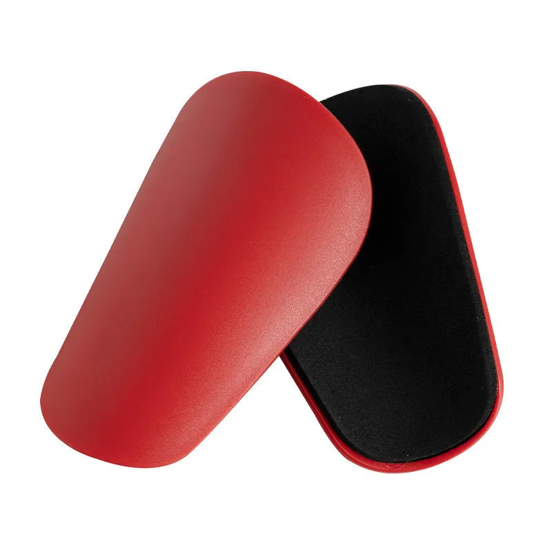 PU mini shin guards for football and sports protection in black, white, red and blue colours