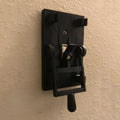 Retro-style cream single pole light switch with a surface-mounted plate and a toggle lever.