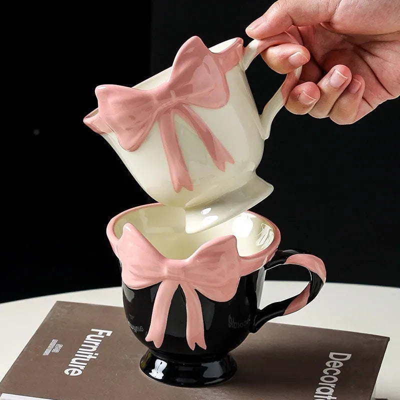 Ceramic heart bow mug with 301-400ml capacity in black pink or white powder colour
