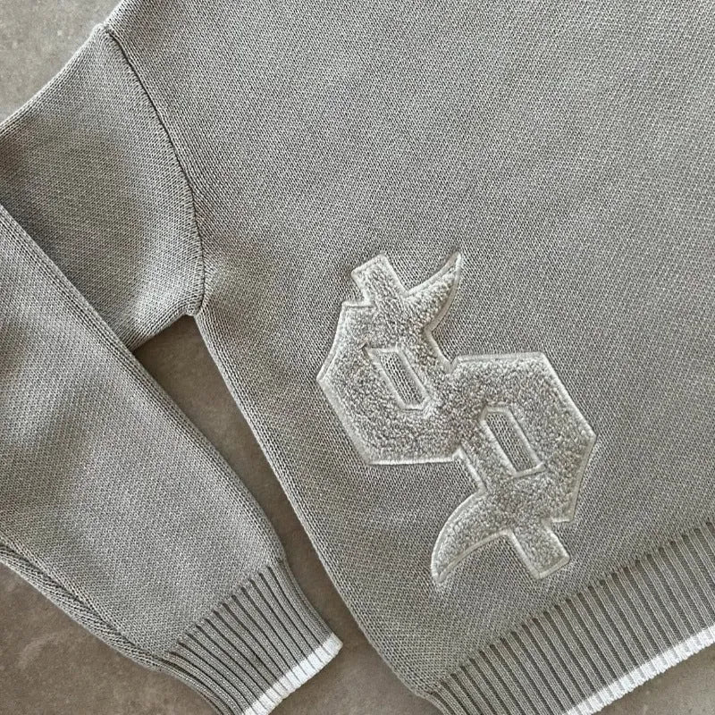 Grey loose-fitting jacquard knitwear coat with long sleeves and pullover style