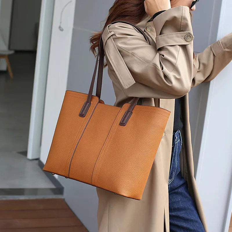 Women's genuine leather commuter shoulder bag with multiple internal zippered compartments in black colour