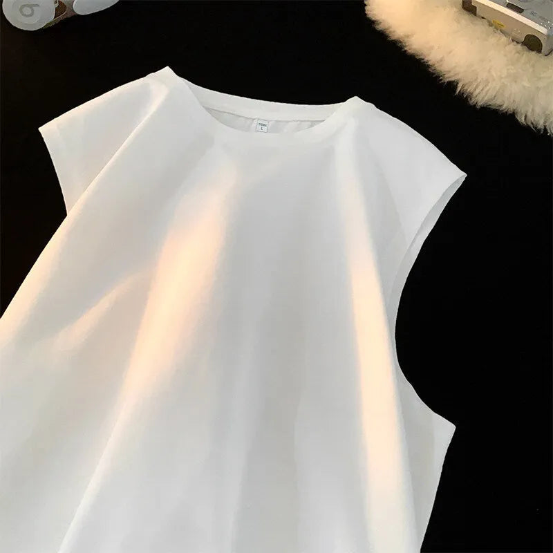 Men's loose cotton tank top in dark grey showing straight hem design and sleeveless construction