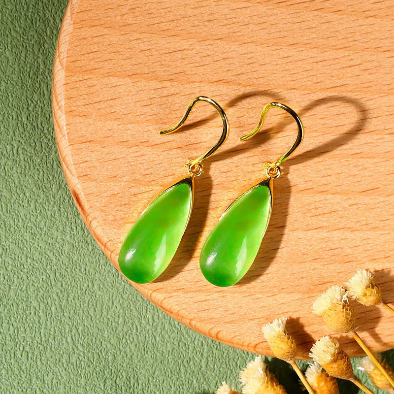 Geometric copper earrings with jade-colour water droplet elements in Chinese banquet style