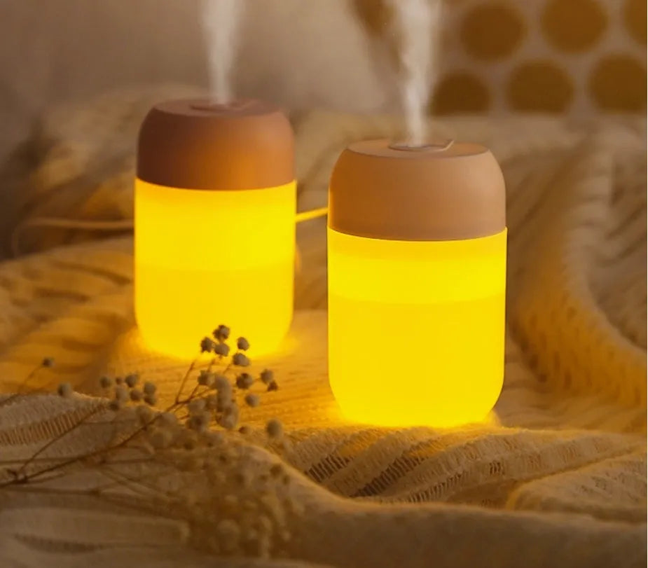 White cylindrical mini humidifier with USB port and aromatherapy function for small-space moisture control