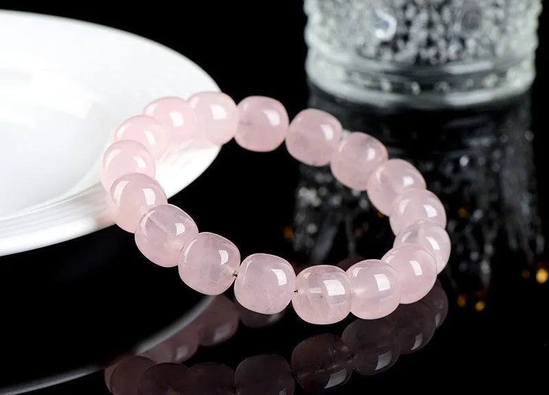 Pink natural crystal barrel bead bracelet with geometric 11mm x 12mm beads.