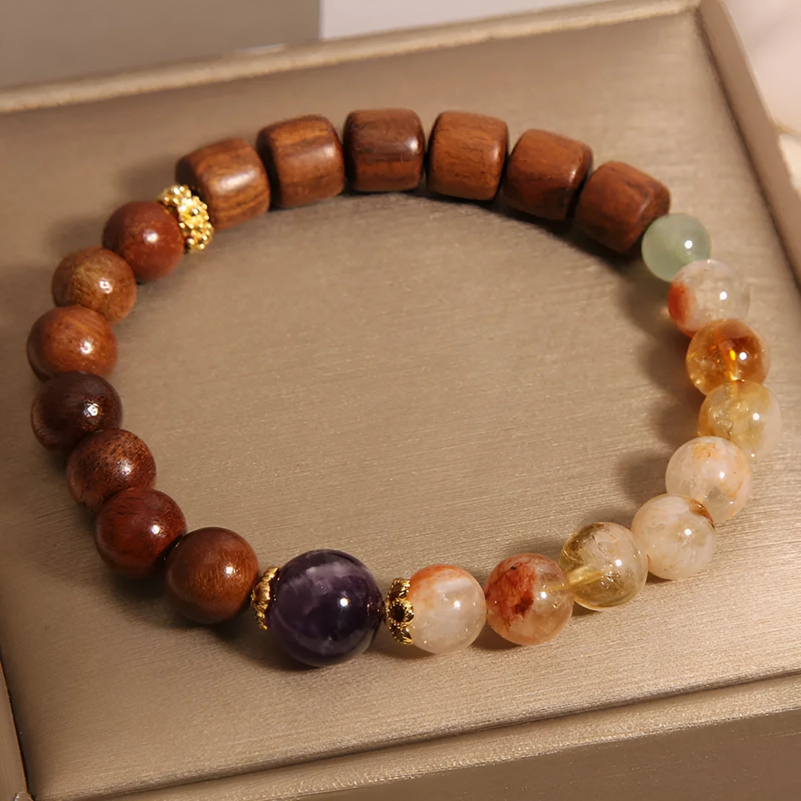 Women's adjustable crystal bracelet with yellow tower crystal, ebony amethyst, pearls, and rhinestones.