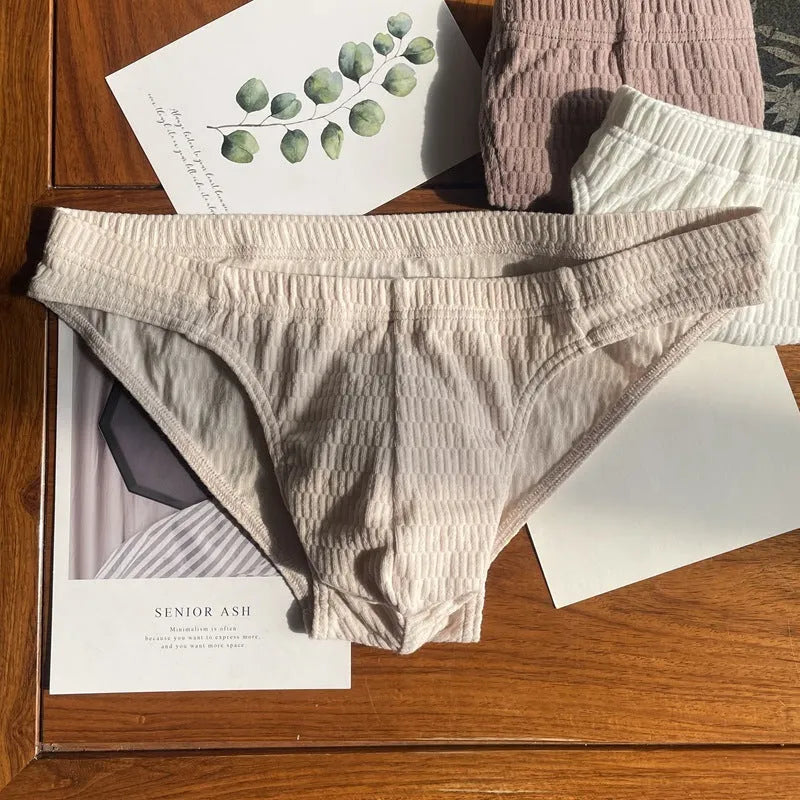 Men's solid colour cotton triangle underwear briefs in mid-waist design on a white background