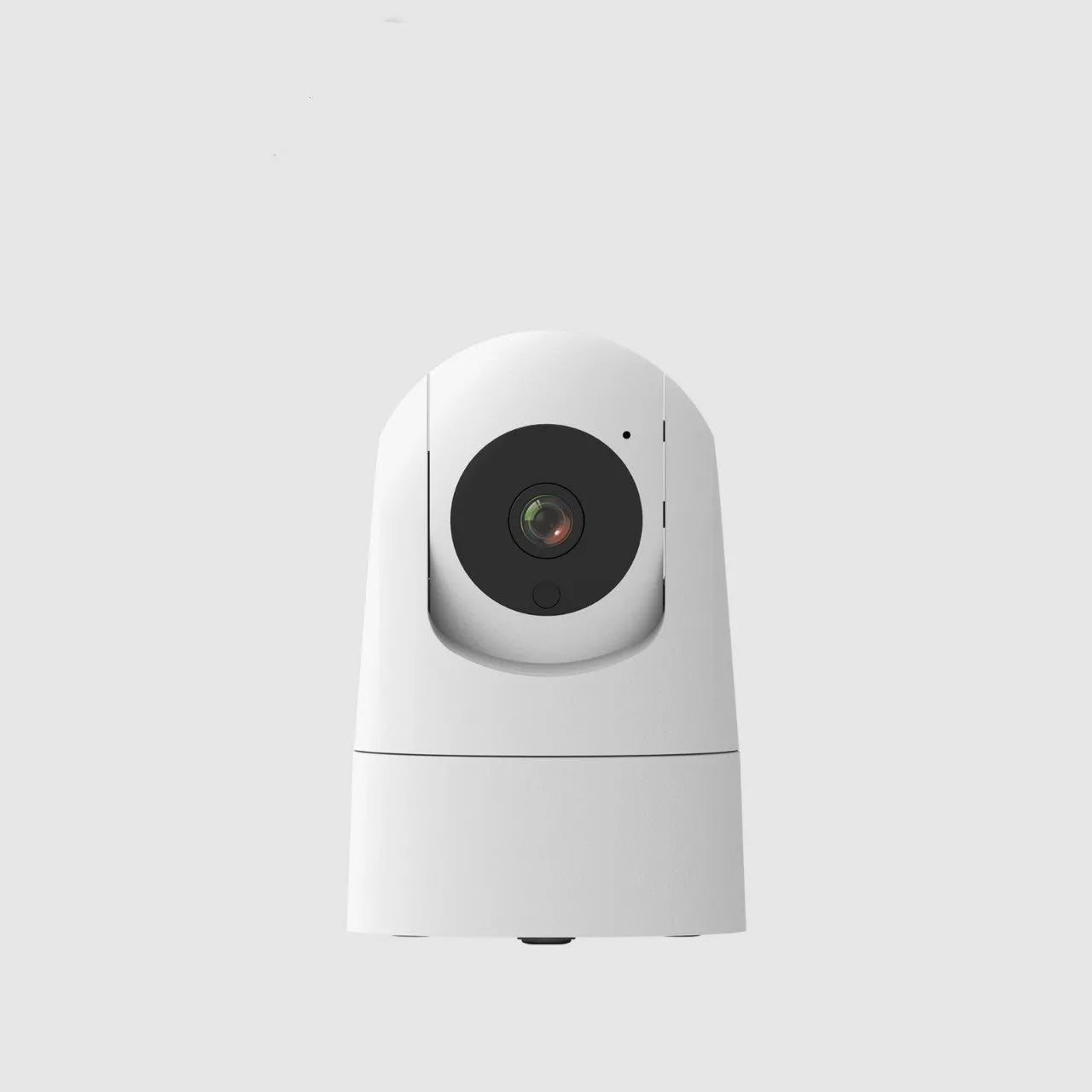 White indoor PTZ security camera with lens and mounting bracket on table