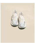 Women's low-top retro sneaker in grey with round toe, rubber sole, and mesh lining.