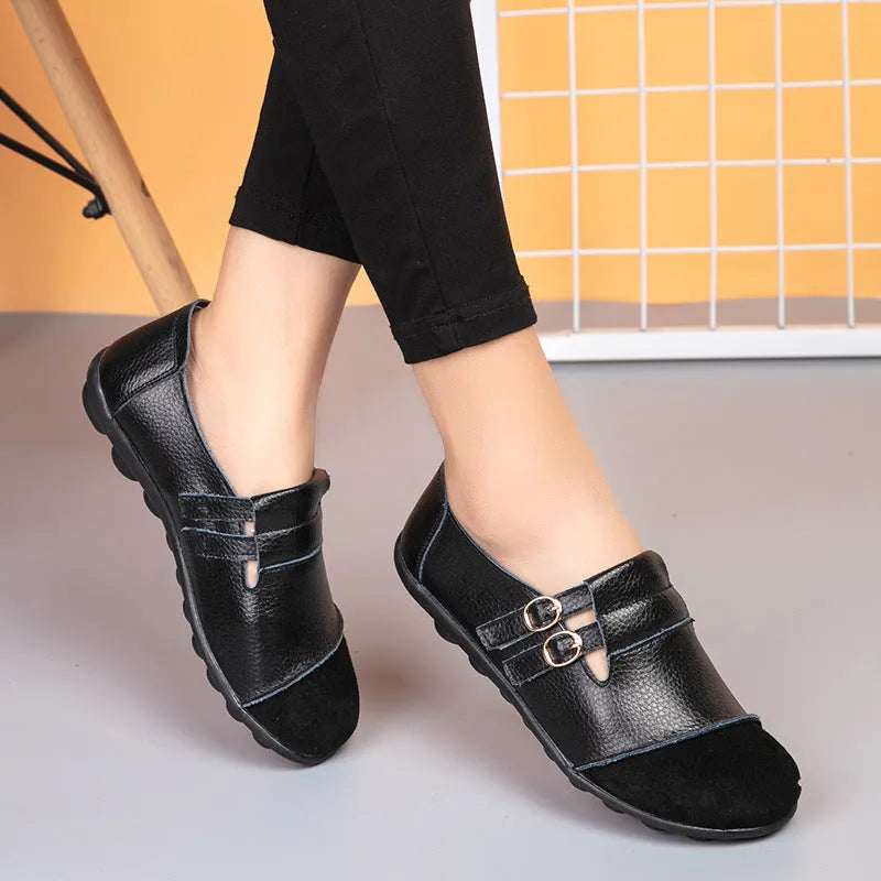 Women's casual round-toe flat shoes with a black Velcro strap on a cow leather upper.
