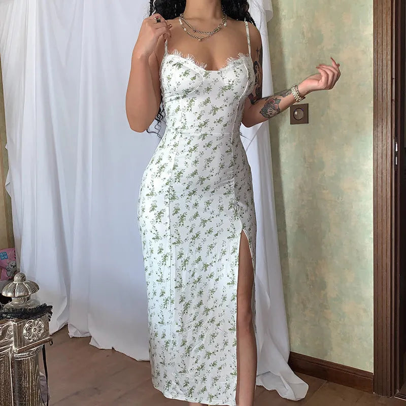 Women's blue lace flower print long dress with suspender neckline and side slit.