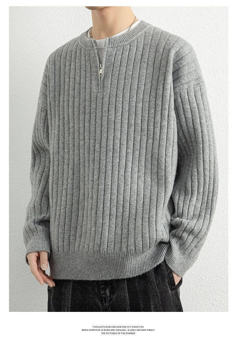 Men's grey loose fit half zip pullover sweater with textured knit and long sleeves