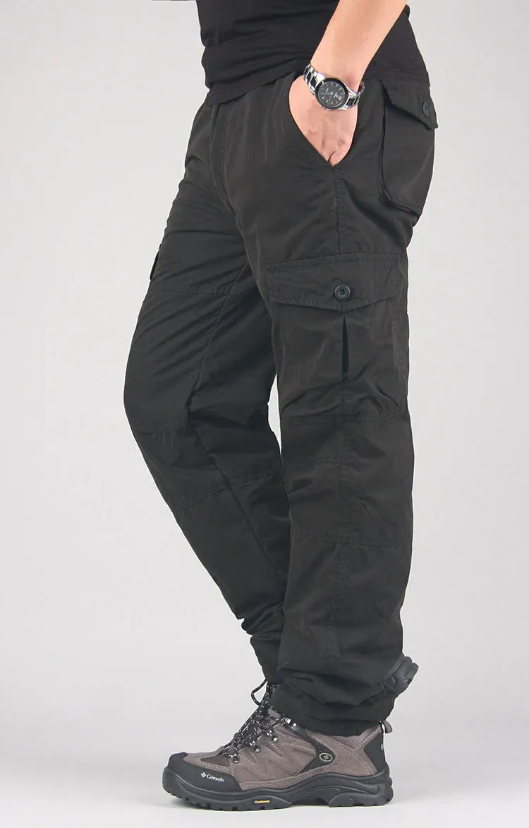 Men's stonewashed cotton overalls with a thick wool lining in khaki, shown with a loose straight-leg fit.