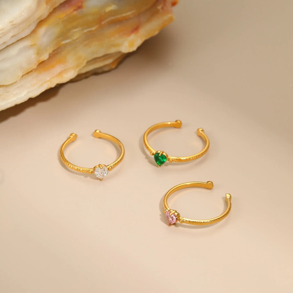 Geometric open-ended ring with heart-shaped zircon inlay in stainless steel