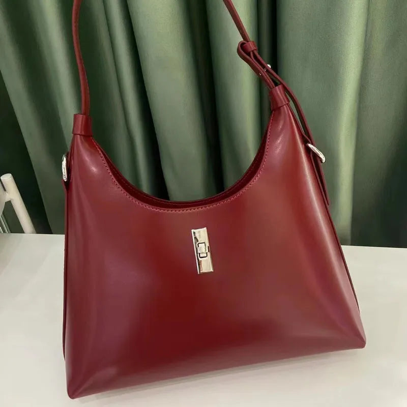 Genuine leather dumpling-shaped crossbody bag with multiple compartments in apricot colour