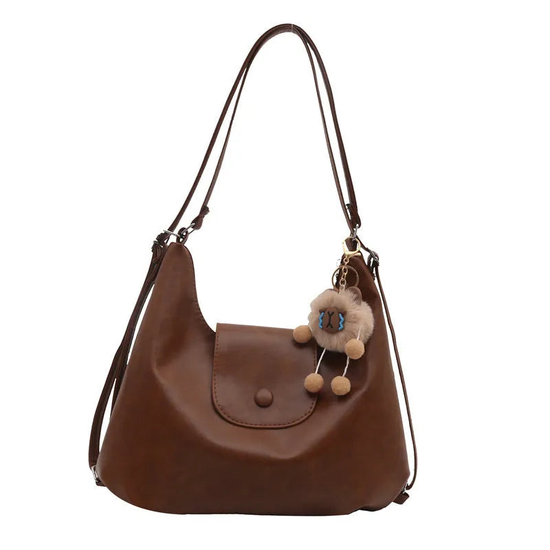 Women's black PU leather single shoulder bag with horizontal square shape and dedicated phone compartment