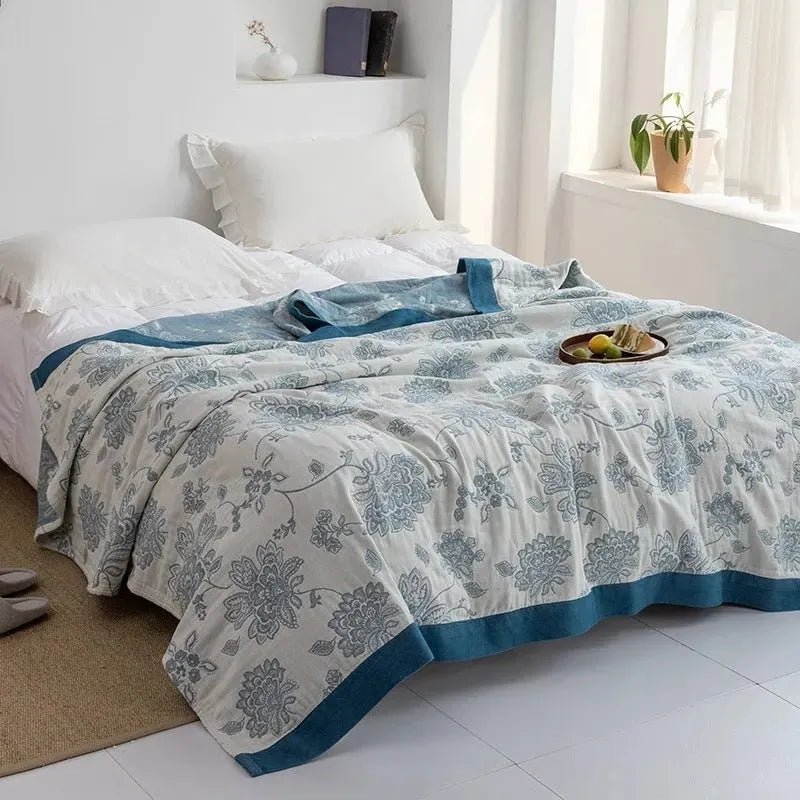 Pure cotton five-layer gauze bed sheet blanket in Roulette Wheel Blue colour, shown in a modern simplicity style.