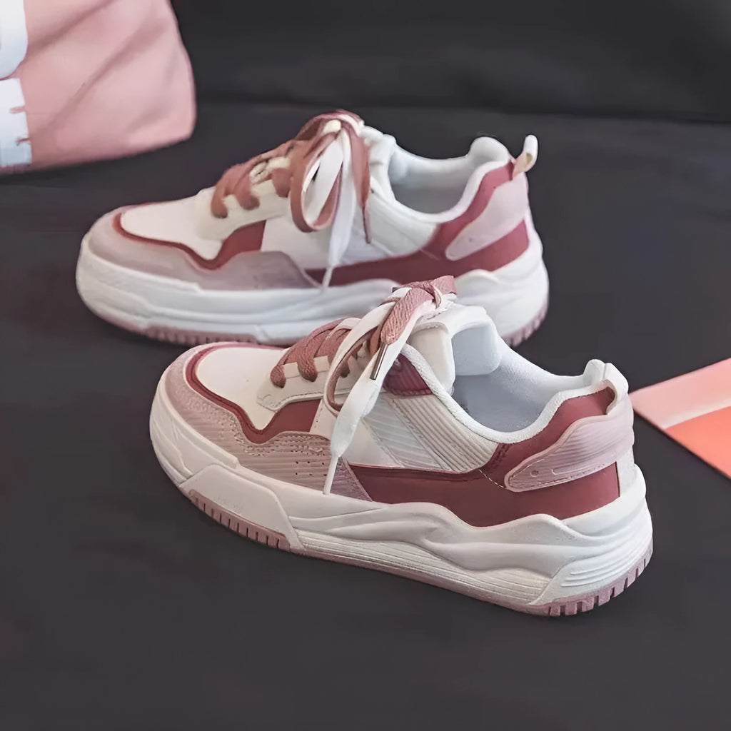 Women's pink and white low-top sneaker with rubber sole for height increasing