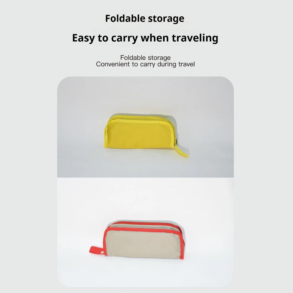 Lightweight foldable camp chair stool in Oxford cloth, shown in a khaki colour, folded into its compact pencil box shape.