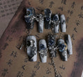 Wearable plastic nail armour suit in heavy industry night blue with ornate rose and tulip floral pattern.