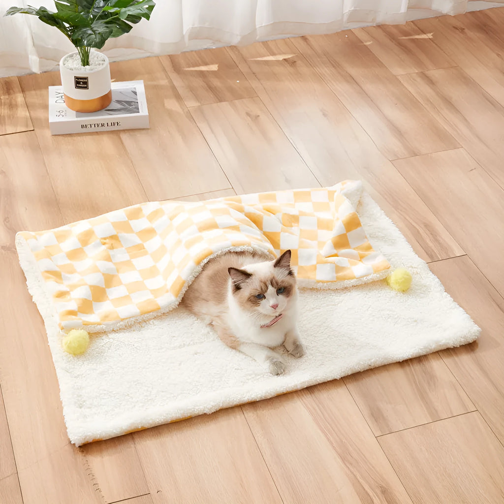 Plaid pattern pet blanket with fur ball trim on soft cotton fleece material for cats and dogs