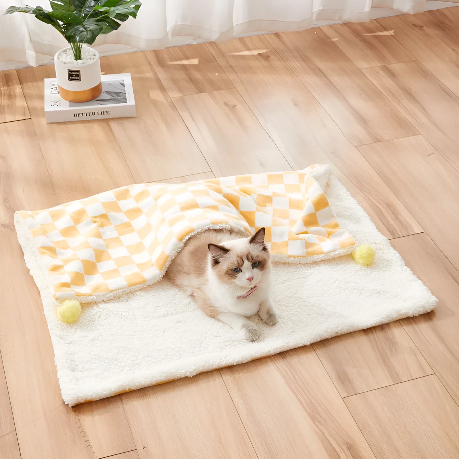 Plaid pattern pet blanket with fur ball trim on soft cotton fleece material for cats and dogs
