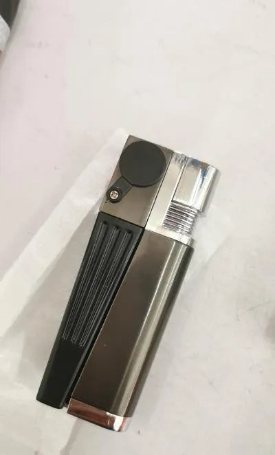 Folding metal pipe lighter showing open position with stash compartment visible