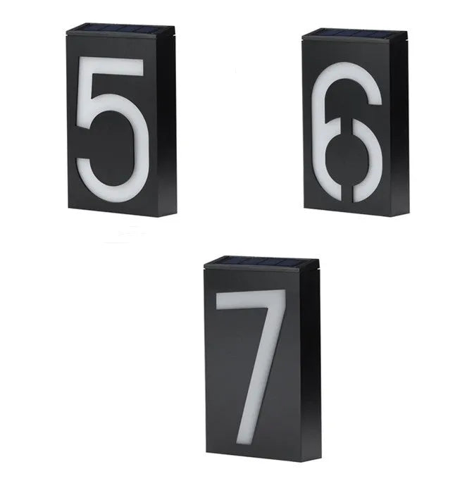 Solar powered house number light with 6 LEDs and IP65 waterproof rating mounted on an exterior wall.