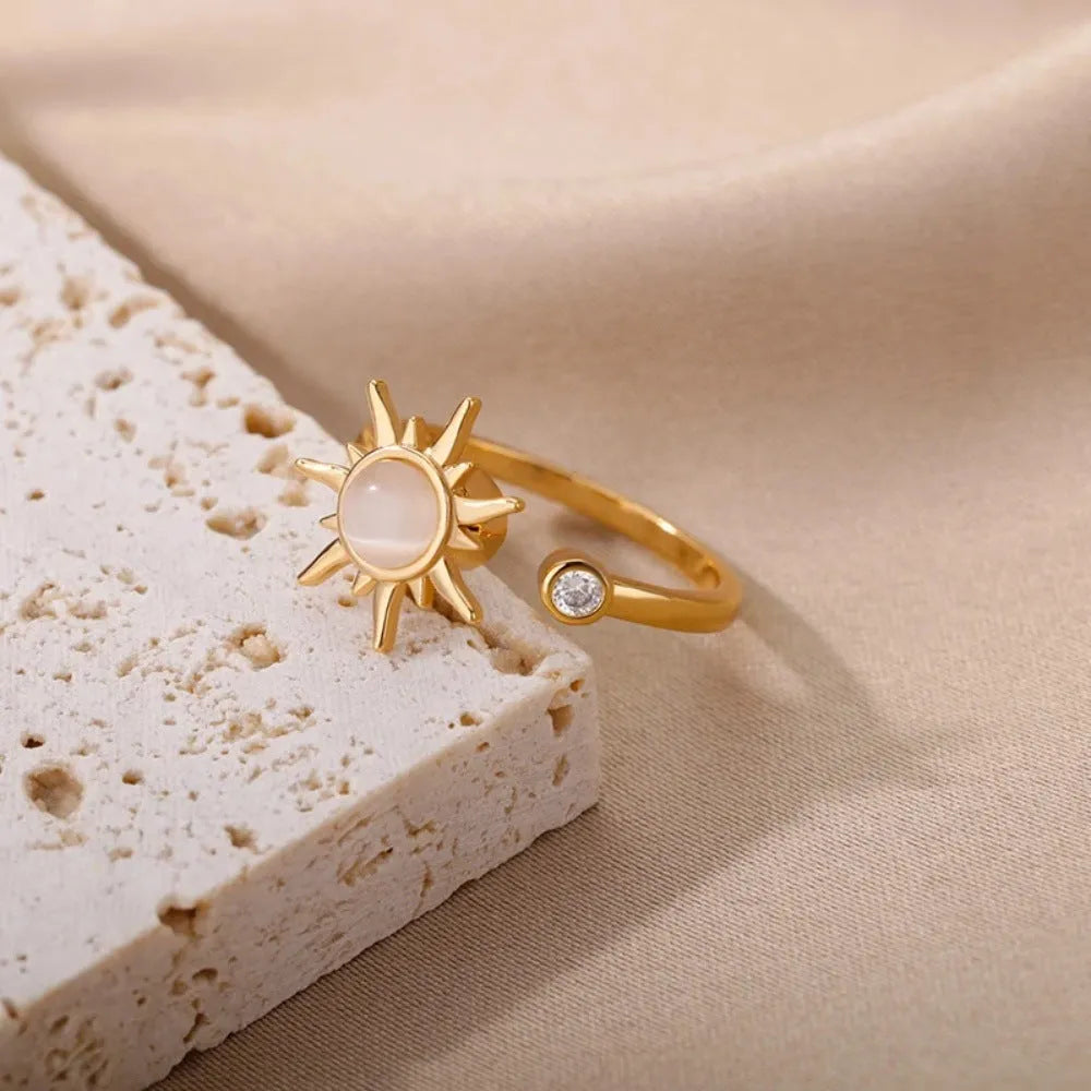 Rotatable decompression ring with adjustable opening in gold electroplated finish