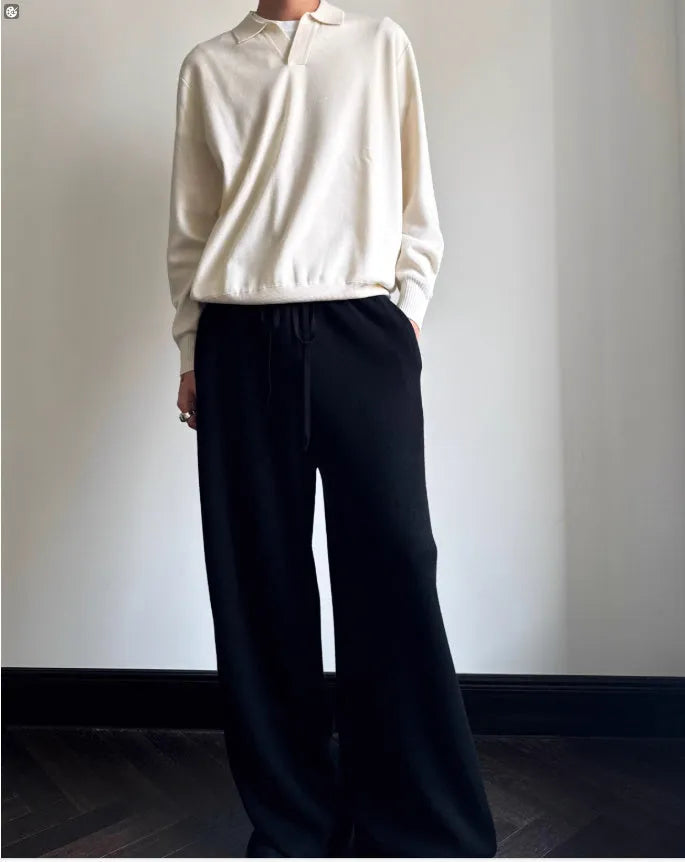 Man wearing a milky white pure wool sweater with a lapel collar and loose fit