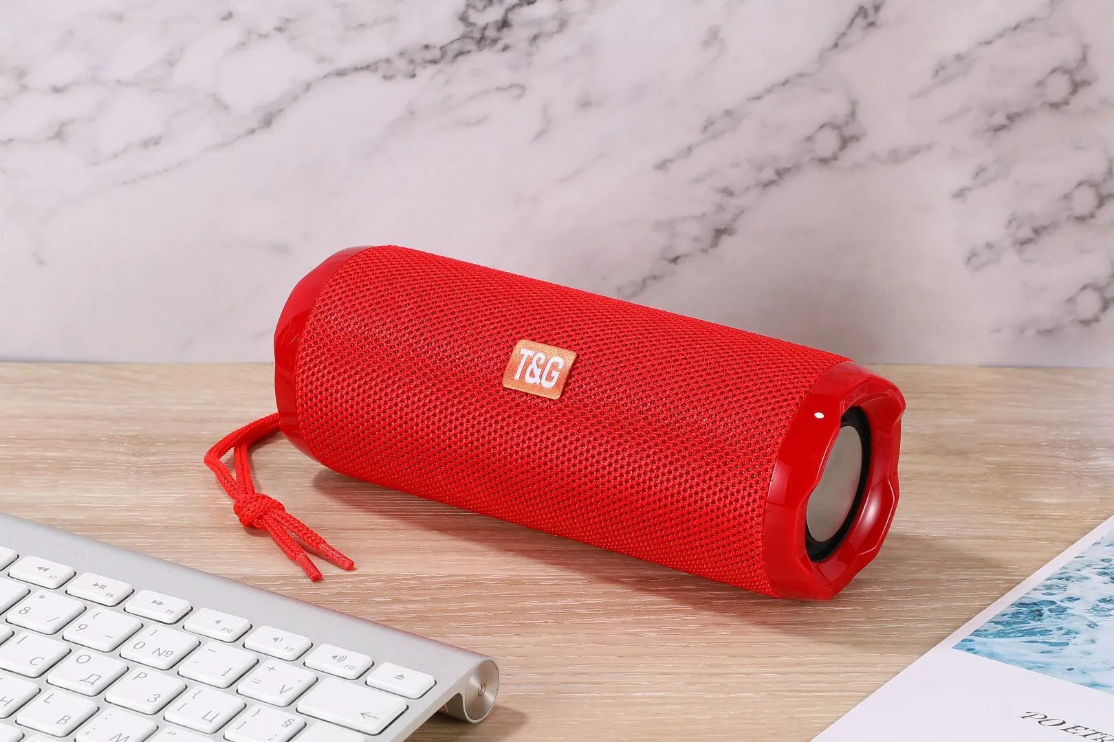 Fabric-covered portable Bluetooth speaker with integrated card holder slot in blue colour