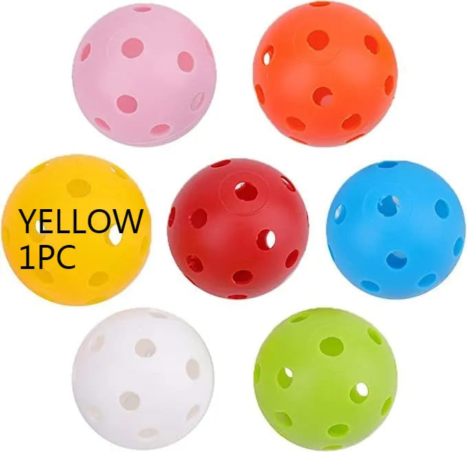 Six multi-colour 42mm golf practice balls in red, orange, blue, green, white, and yellow in a net.