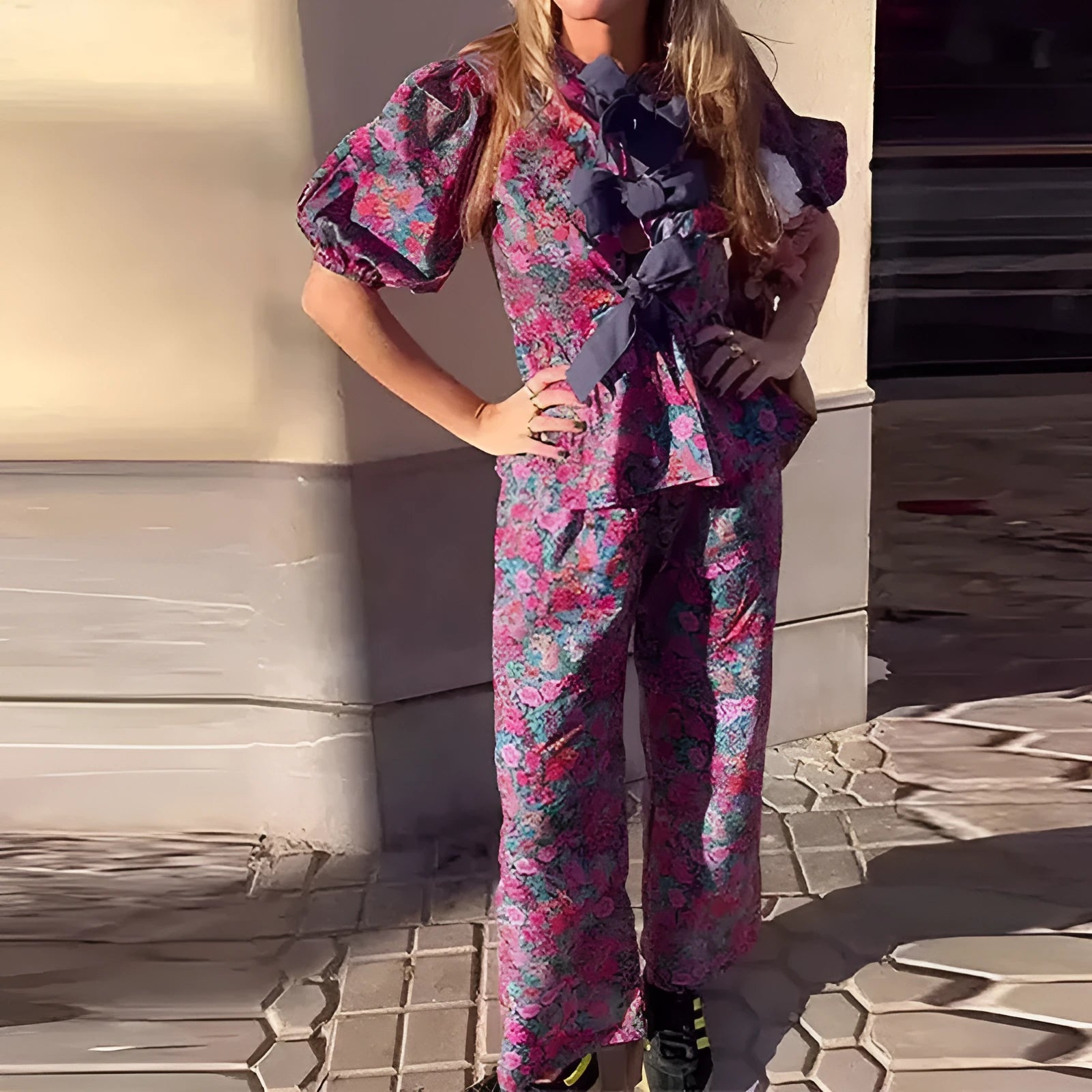 Women's floral print trousers suit with tie-neck top and puff sleeves