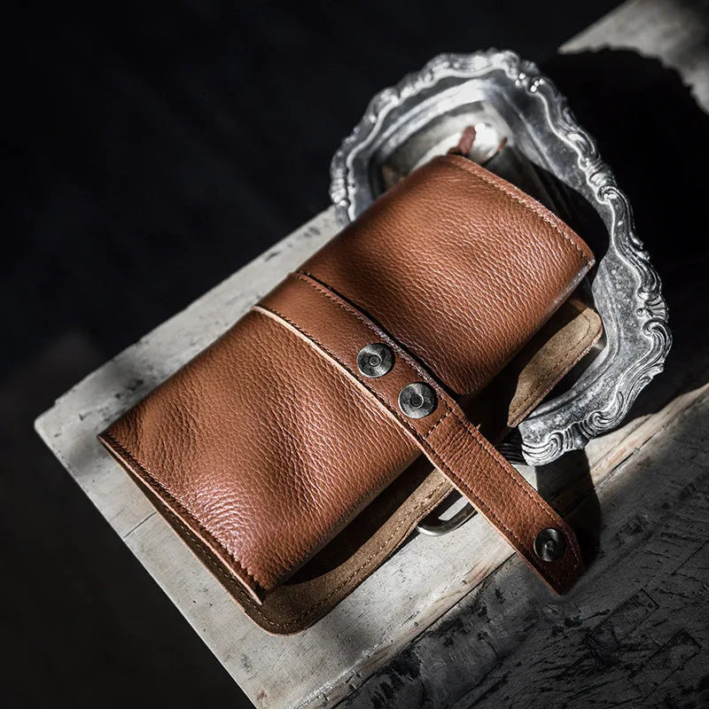 Handmade cow leather vintage bifold wallet in black or dark brown with tape extraction closure