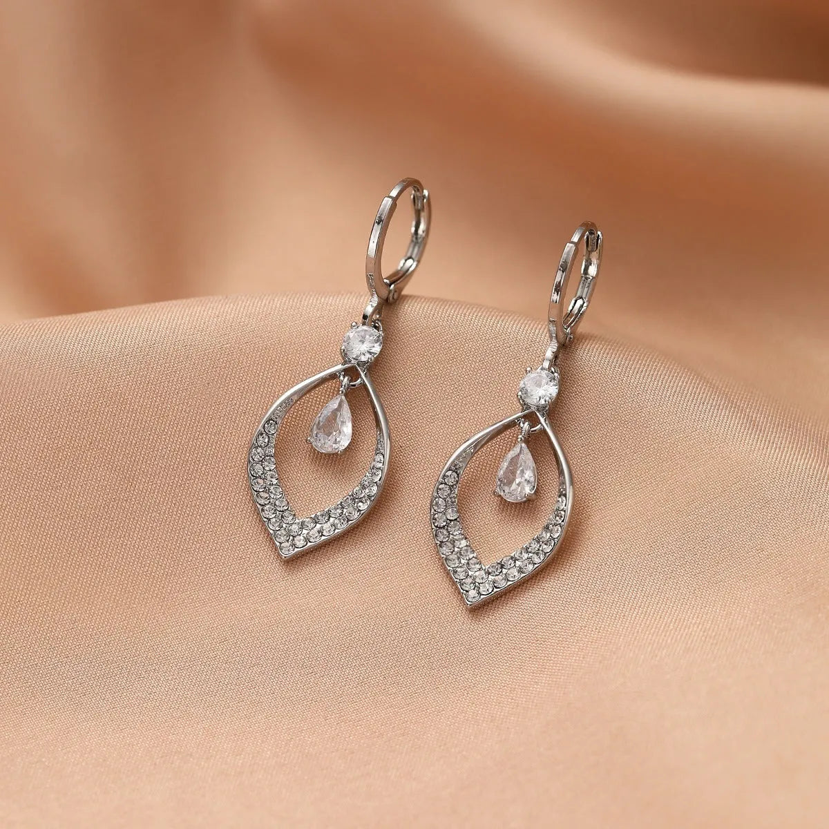 Women's copper zircon water drop tassel dangle earrings with gold or silver ear buckles.