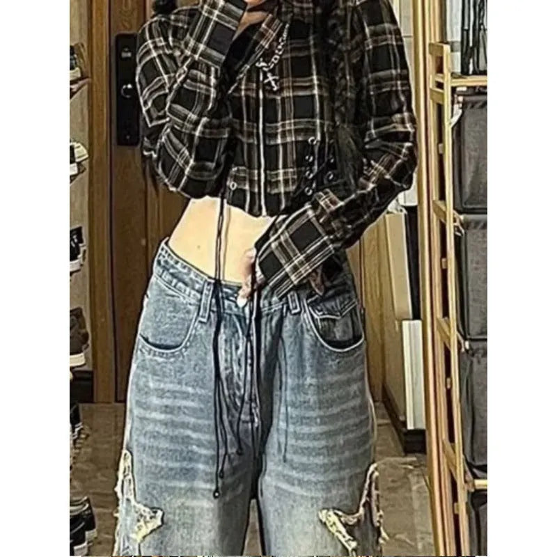 Blue high-waisted wide-leg denim trousers with straight-leg design on hanger